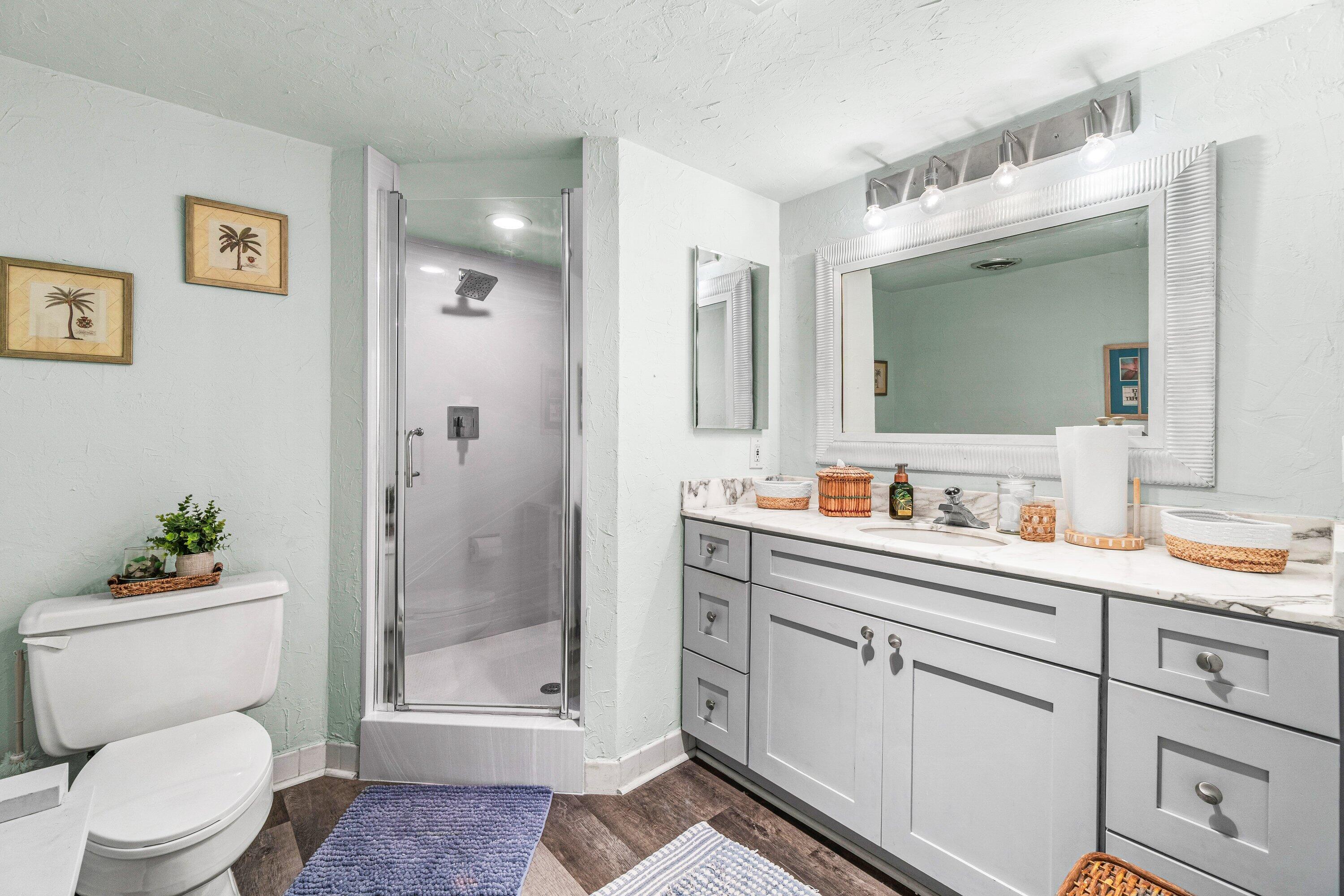 4301 North Ocean Boulevard, Unit 708 Boca Raton, FL 33431 - Photo 26 of 51 a bathroom with a sink a toilet and shower