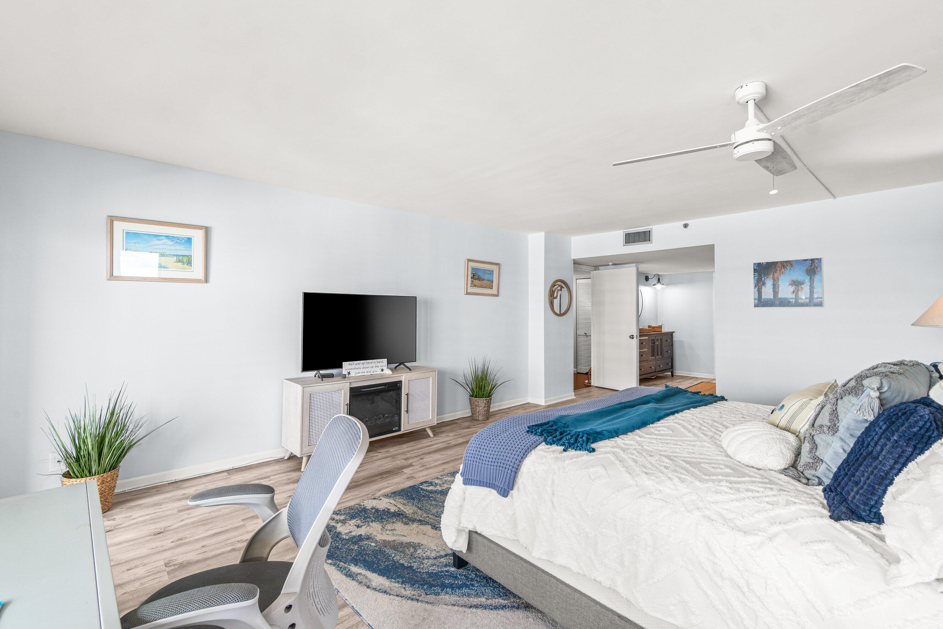 4301 North Ocean Boulevard, Unit 708 Boca Raton, FL 33431 - Photo 28 of 51 a bedroom with a bed and a flat screen tv