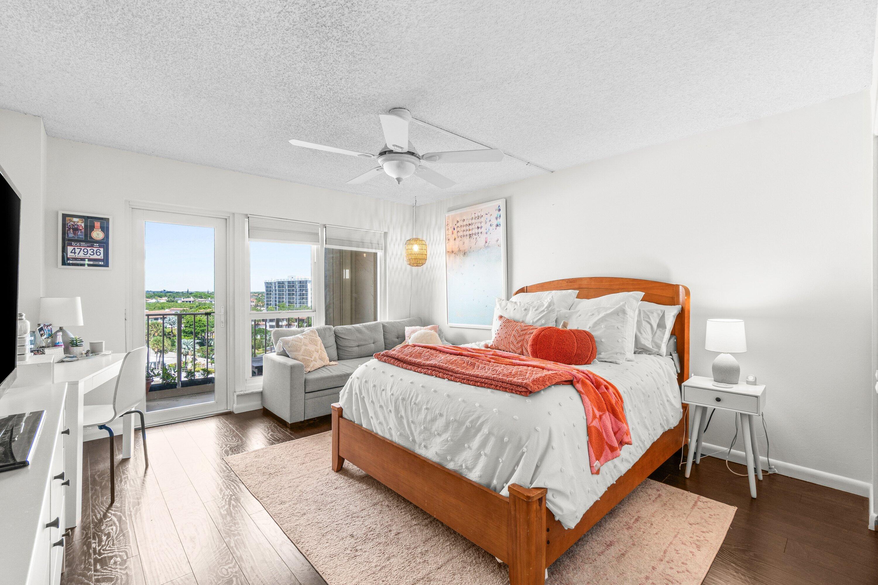 4301 North Ocean Boulevard, Unit 708 Boca Raton, FL 33431 - Photo 33 of 51 a bedroom with a bed and large windows