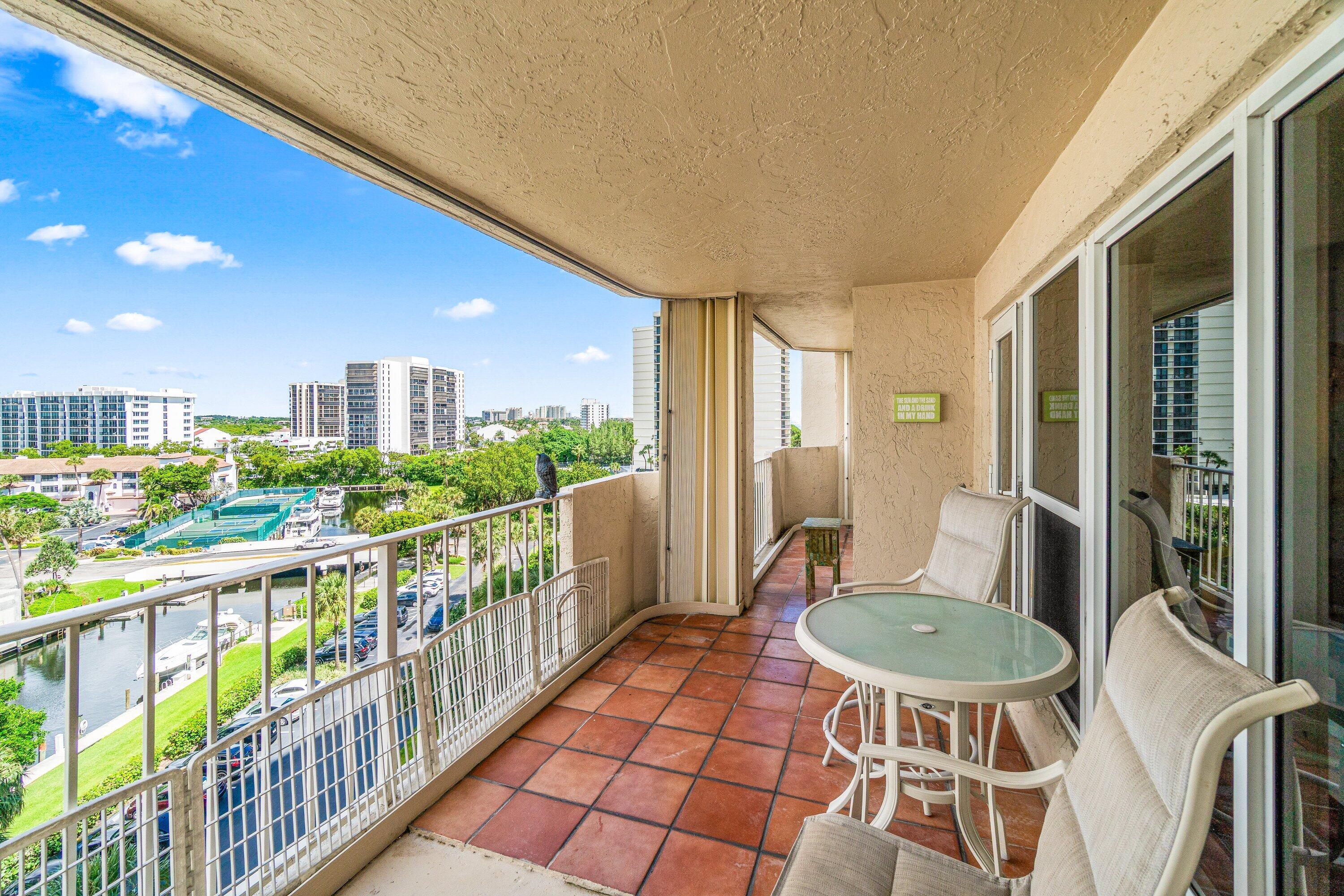 4301 North Ocean Boulevard, Unit 708 Boca Raton, FL 33431 - Photo 40 of 51 a view of a chairs and table in the balcony