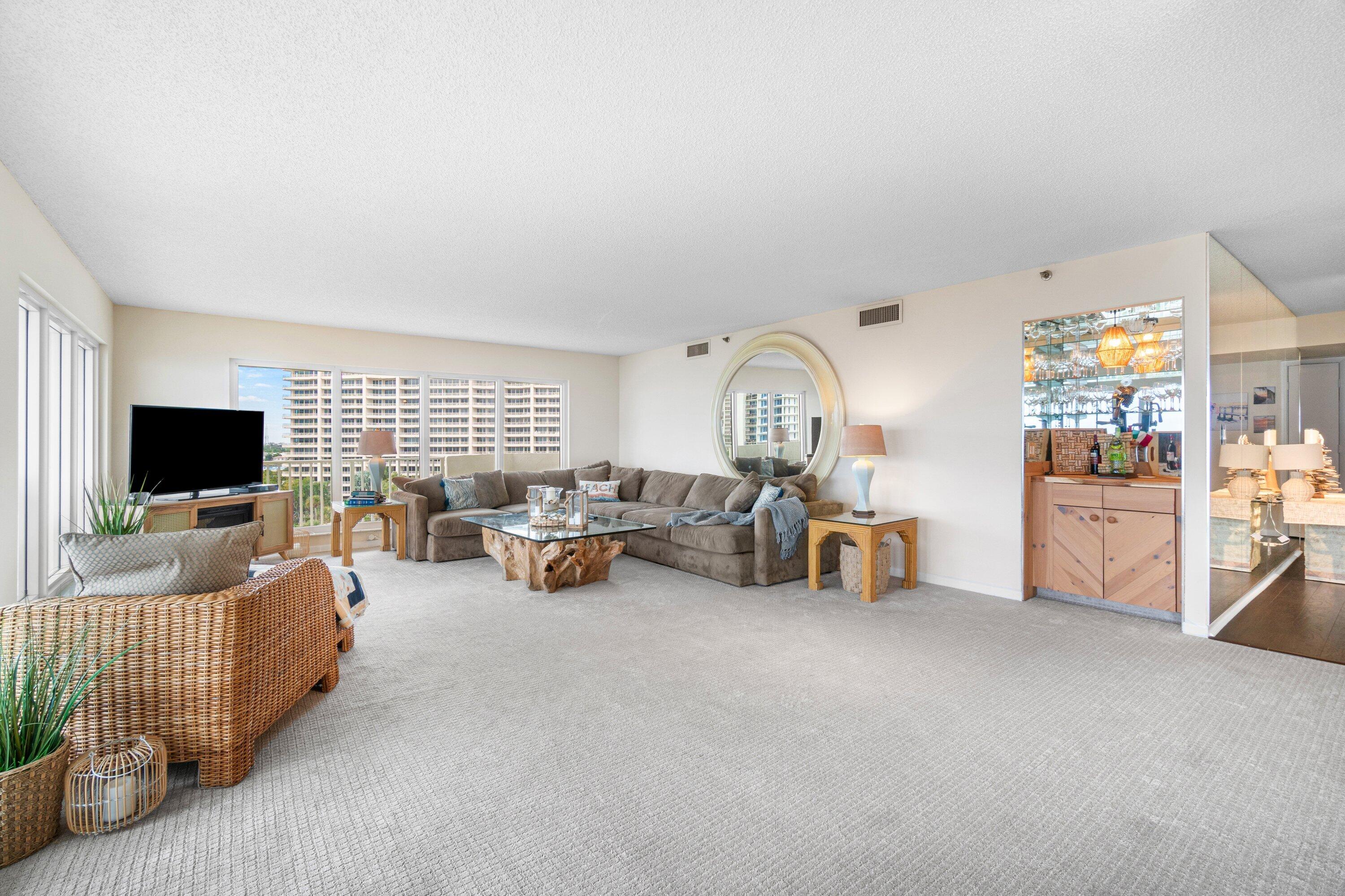 4301 North Ocean Boulevard, Unit 708 Boca Raton, FL 33431 - Photo 6 of 51 a living room with furniture and a flat screen tv