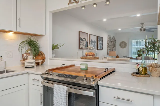 a kitchen with a sink stove and cabinets