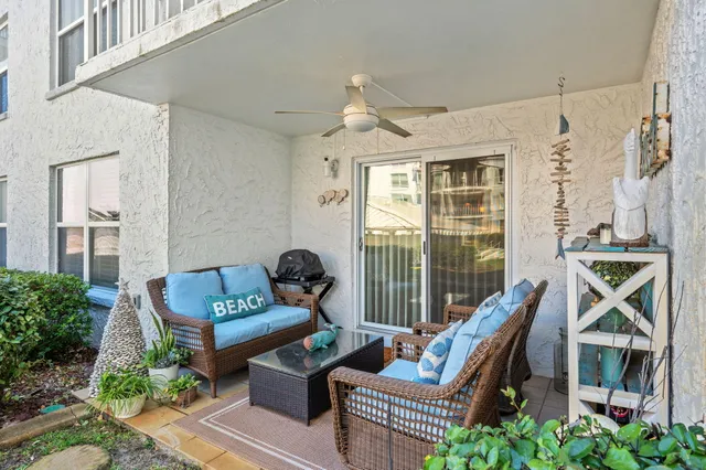 a view of a livingroom with wooden floor and a hallway