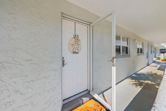 a view of swimming pool with outdoor seating and plants