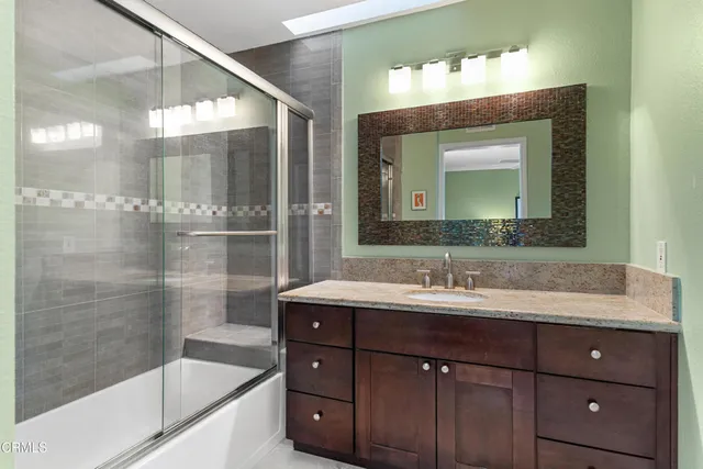 a bathroom with a shower and toilet