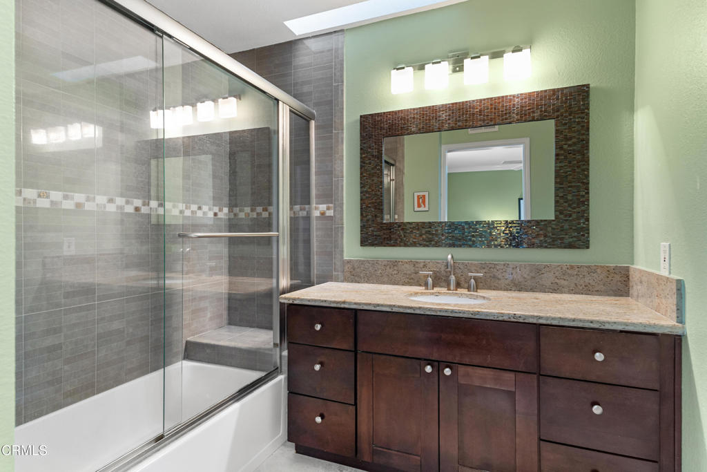 832 Magnolia Avenue, Unit 2 Pasadena, CA 91106 - Photo 14 of 20 a bathroom with a sink and a mirror