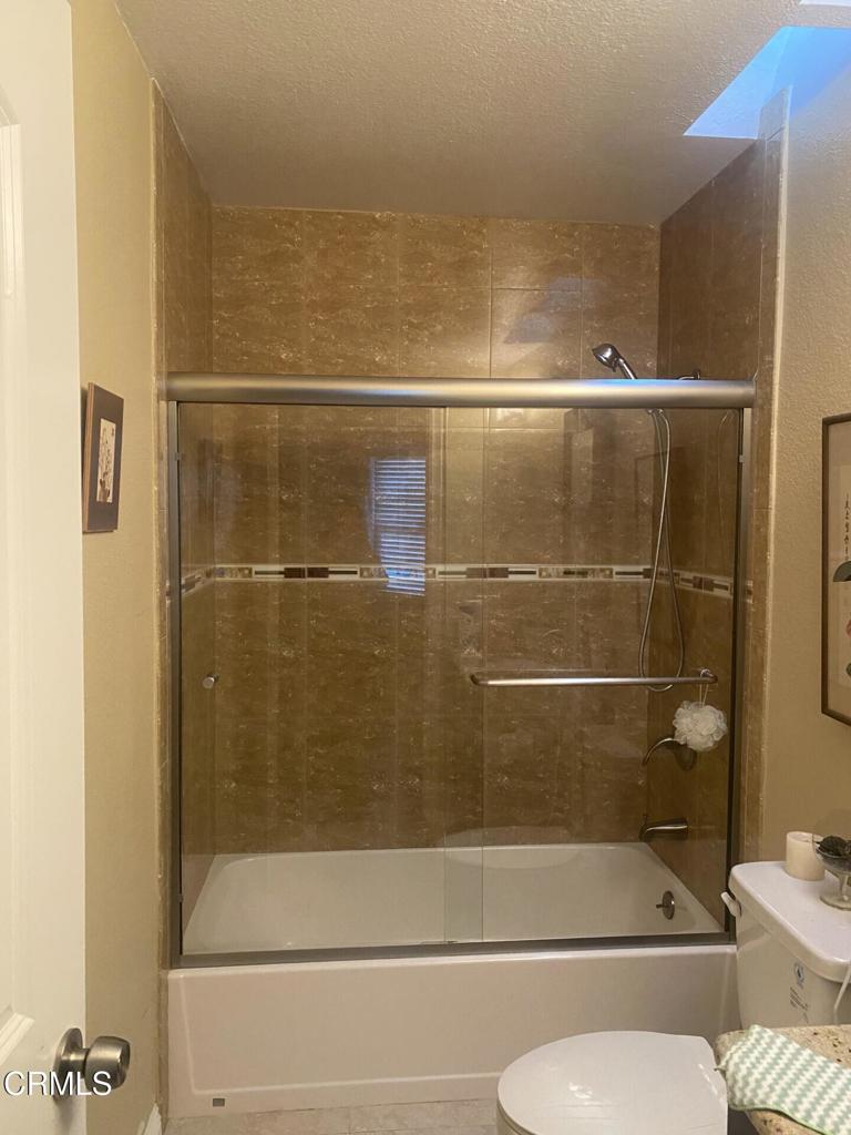 832 Magnolia Avenue, Unit 2 Pasadena, CA 91106 - Photo 15 of 20 a bathroom with a shower and toilet