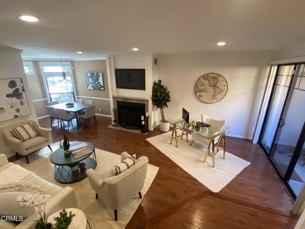 832 Magnolia Avenue, Unit 2 Pasadena, CA 91106 - Photo 2 of 20 a living room with furniture a clock on wall and a window