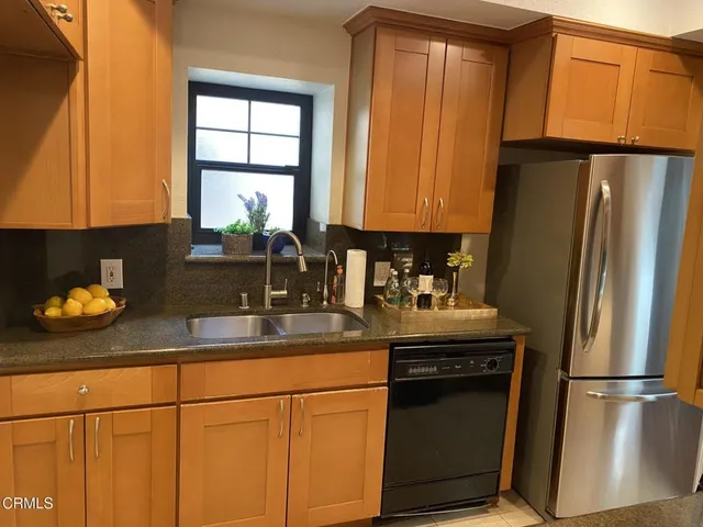 a stove top oven sitting inside of a kitchen