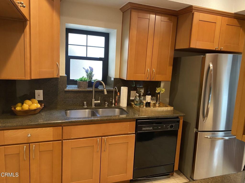832 Magnolia Avenue, Unit 2 Pasadena, CA 91106 - Photo 10 of 20 a kitchen with granite countertop a refrigerator and a sink