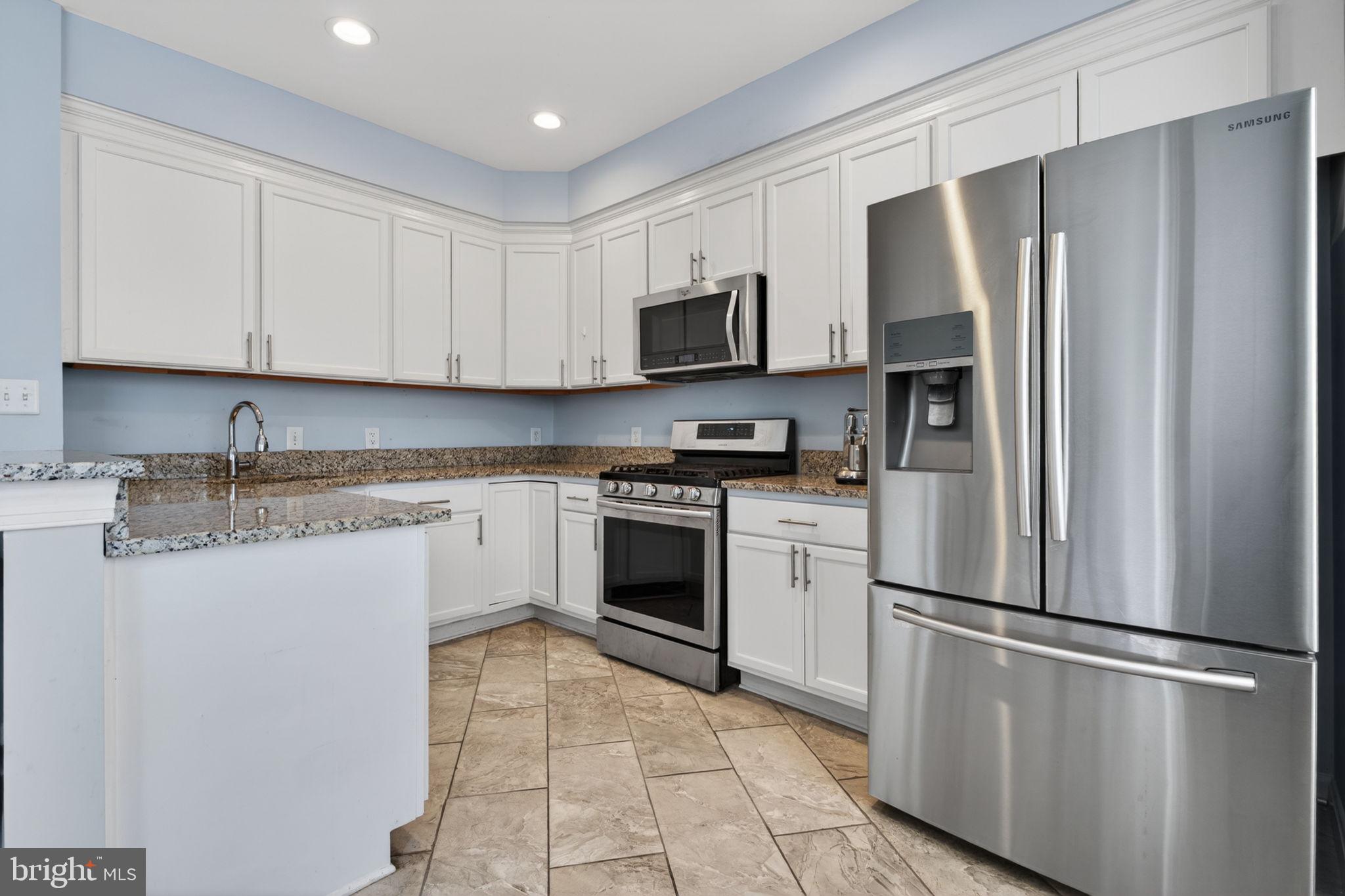 6006 Lincolnia Road Alexandria, VA 22312 - Photo 11 of 42 Modern kitchen with sleek finishes.