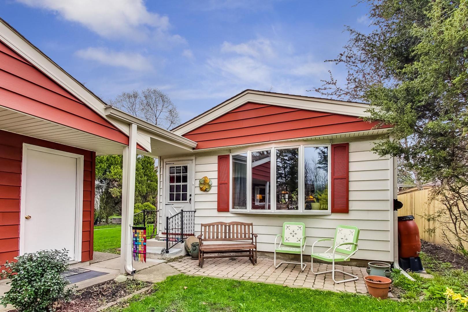 a view of an house with backyard porch and furniture