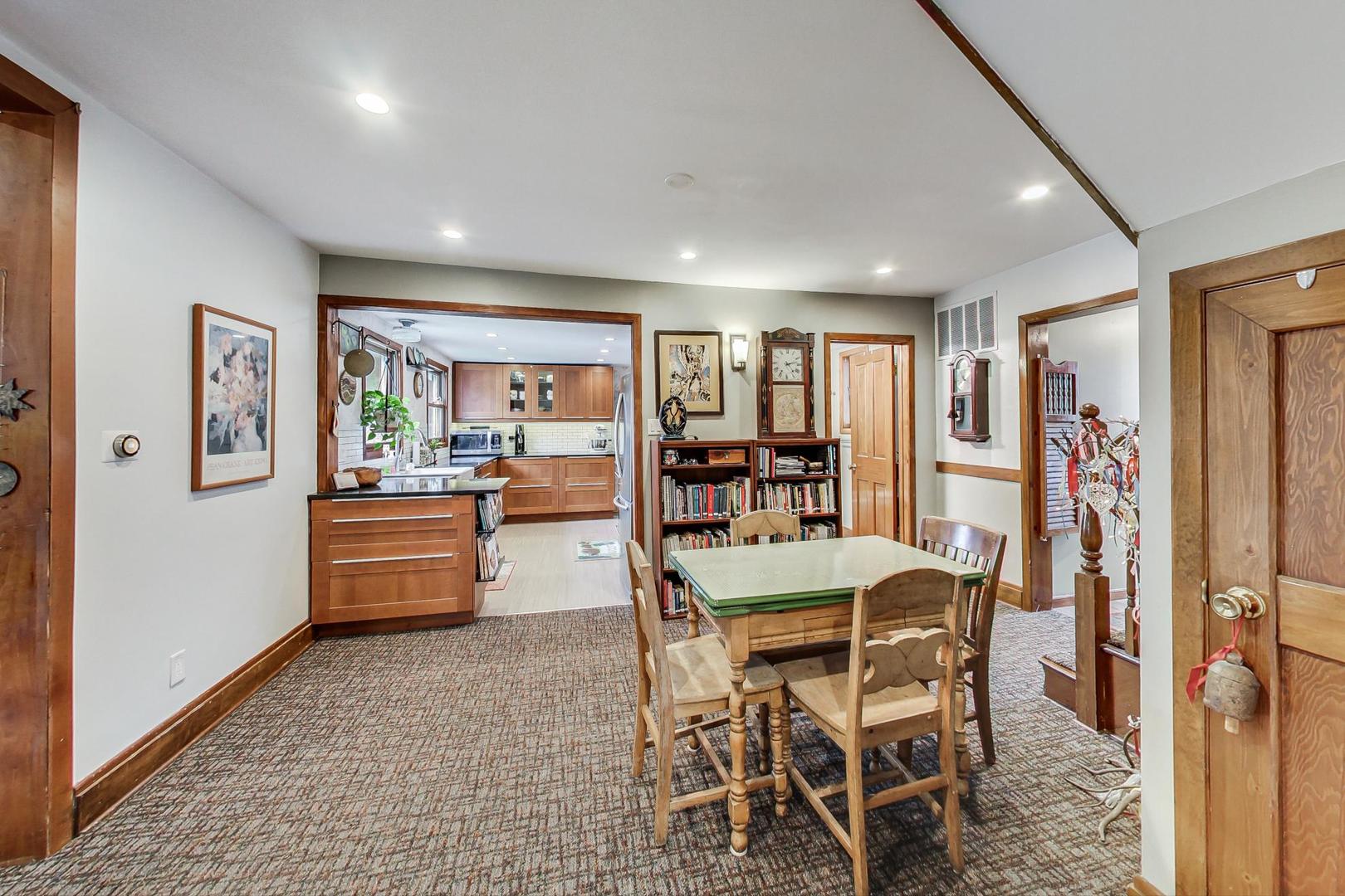 208 Waubansee Road Riverside, IL 60546 - Photo 11 of 38 a dining room with furniture and a floor to ceiling window