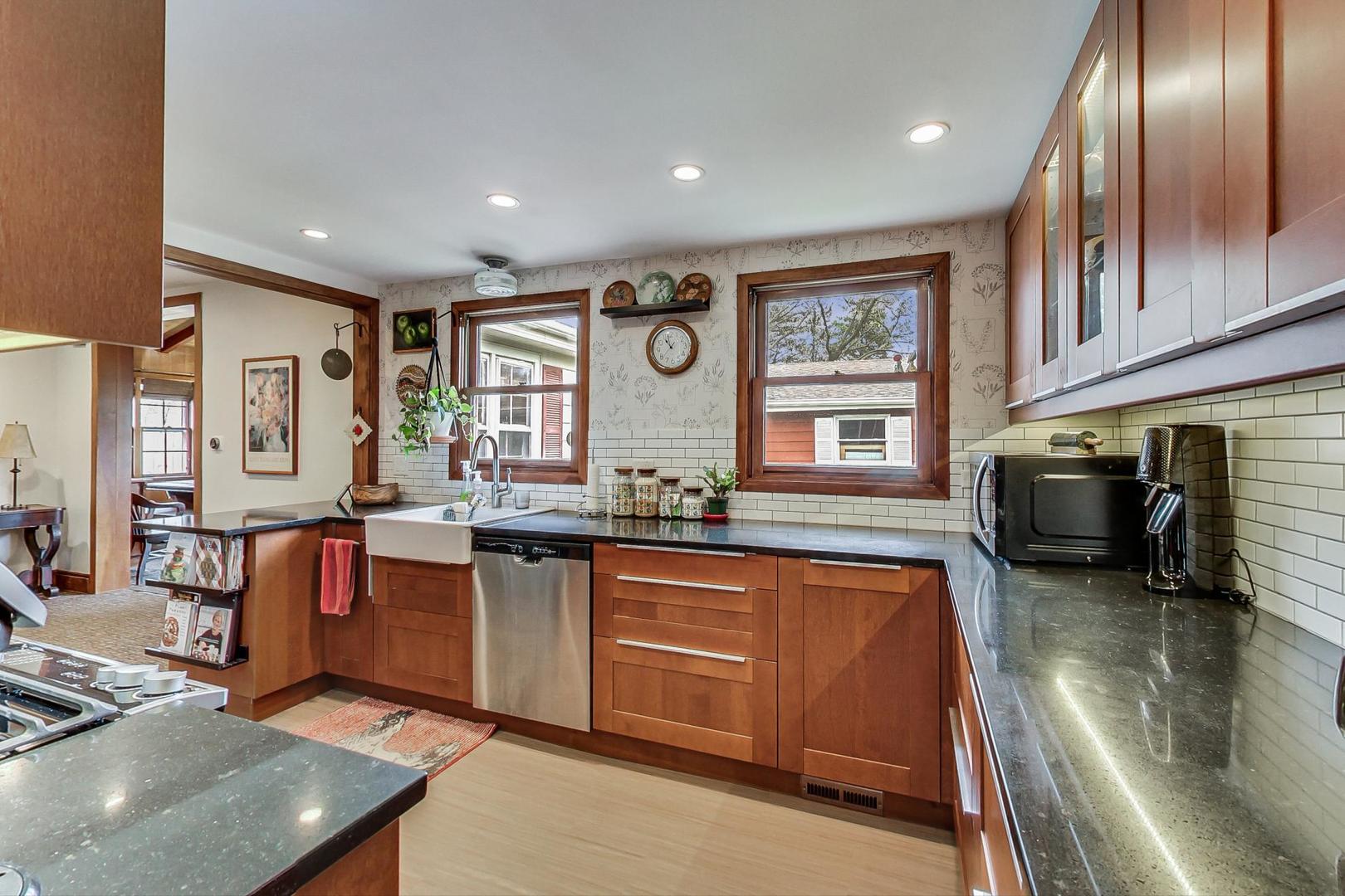 208 Waubansee Road Riverside, IL 60546 - Photo 16 of 38 a open kitchen with stainless steel appliances granite countertop a sink dishwasher stove and oven