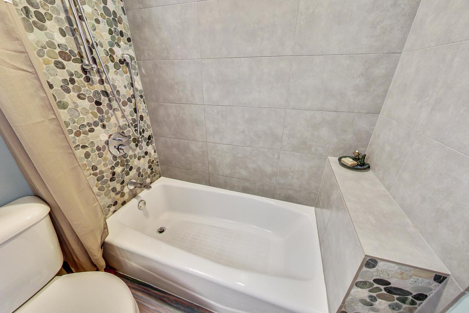 208 Waubansee Road Riverside, IL 60546 - Photo 19 of 38 a bathroom with a bathtub and shower
