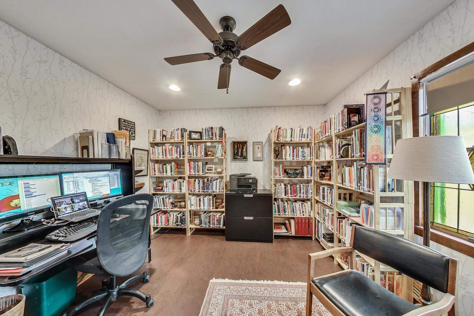 208 Waubansee Road Riverside, IL 60546 - Photo 20 of 38 a work room with furniture and a book shelf