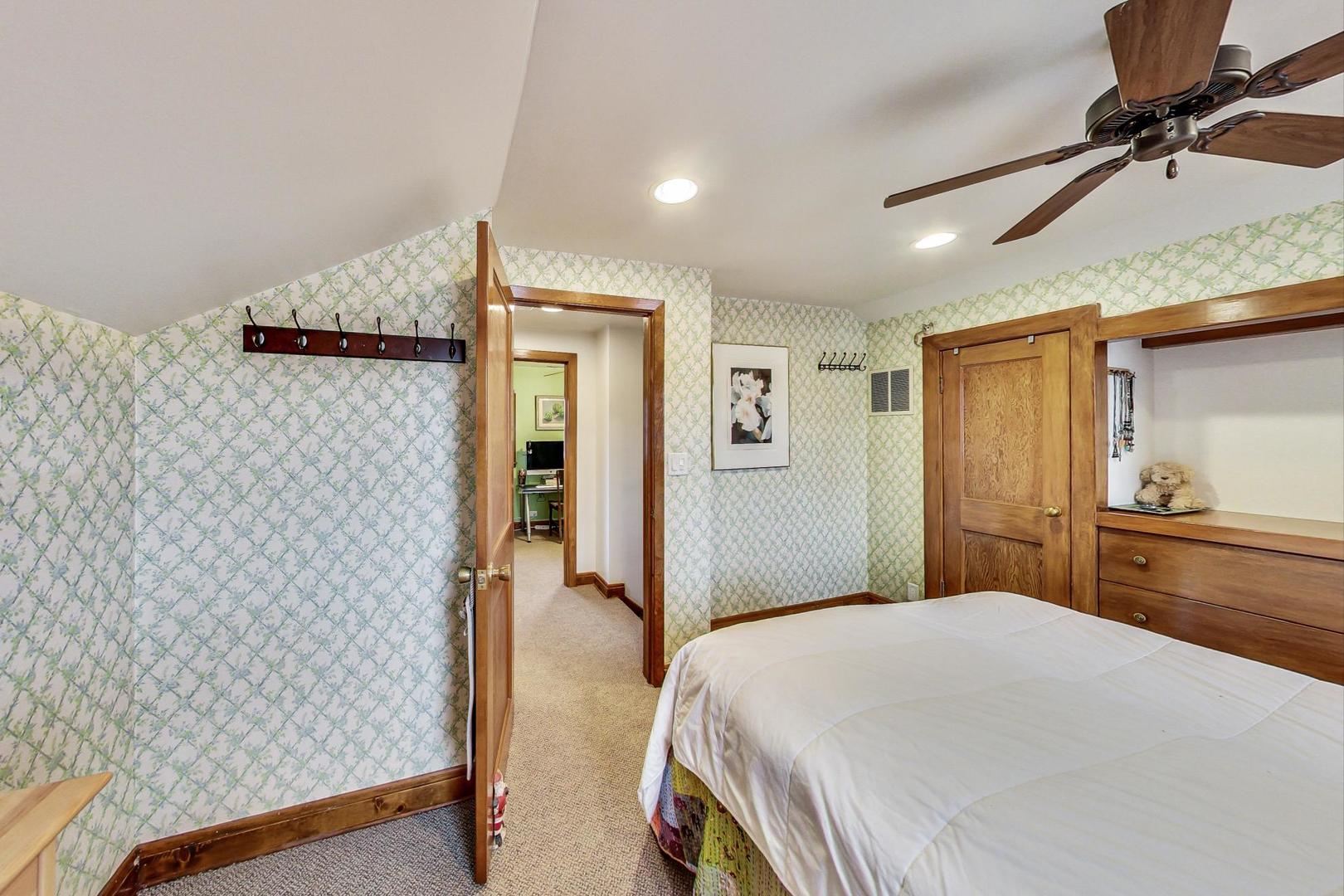 208 Waubansee Road Riverside, IL 60546 - Photo 27 of 38 a bedroom with a bed and a walk in closet