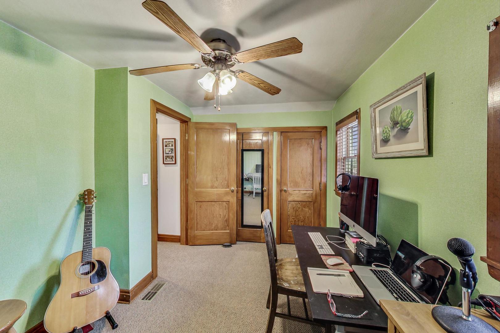 208 Waubansee Road Riverside, IL 60546 - Photo 29 of 38 a room with furniture and ceiling fan