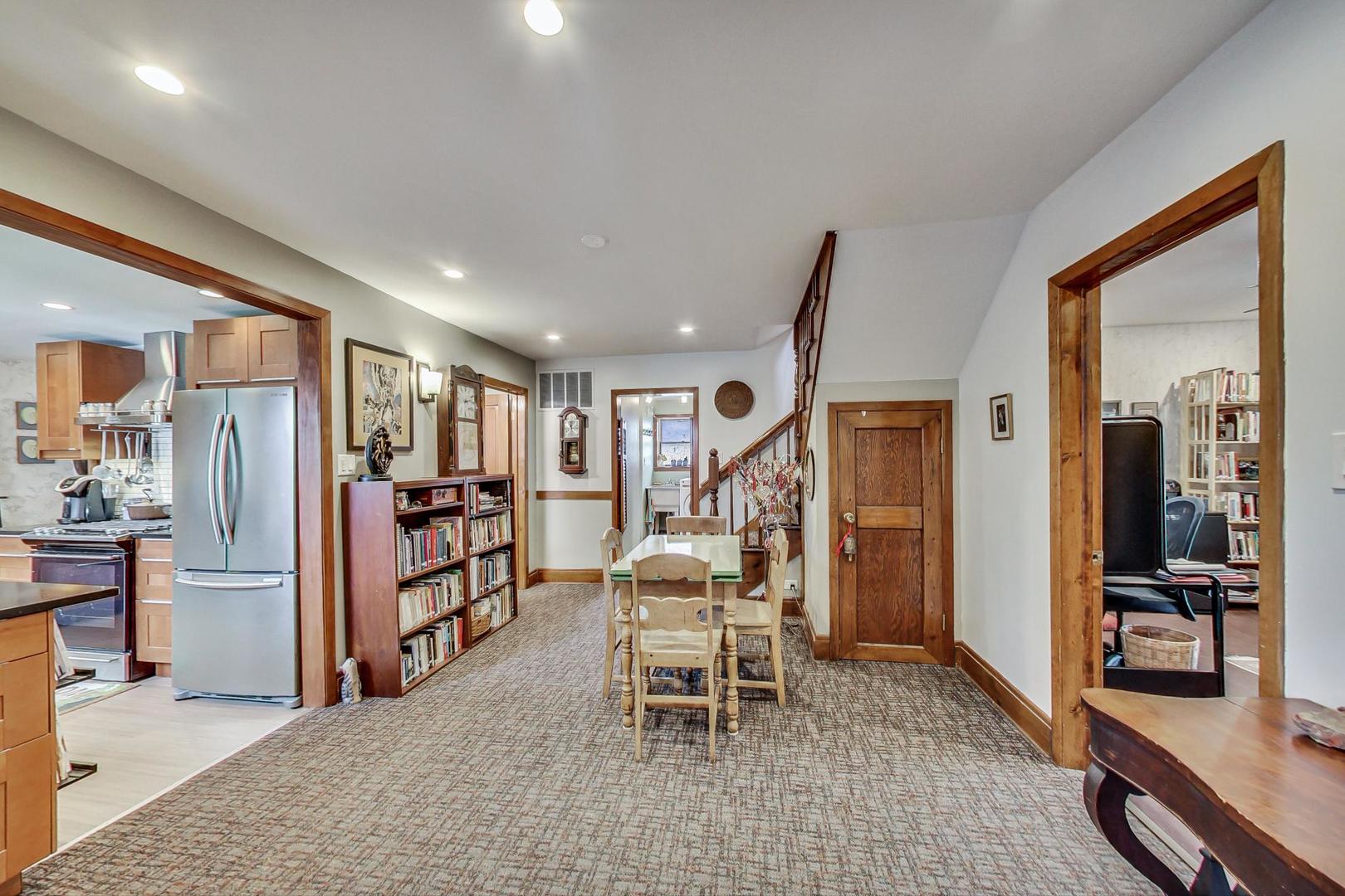 208 Waubansee Road Riverside, IL 60546 - Photo 10 of 38 a dining room with furniture and a large window
