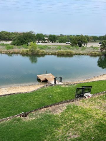 a view of a lake with a city