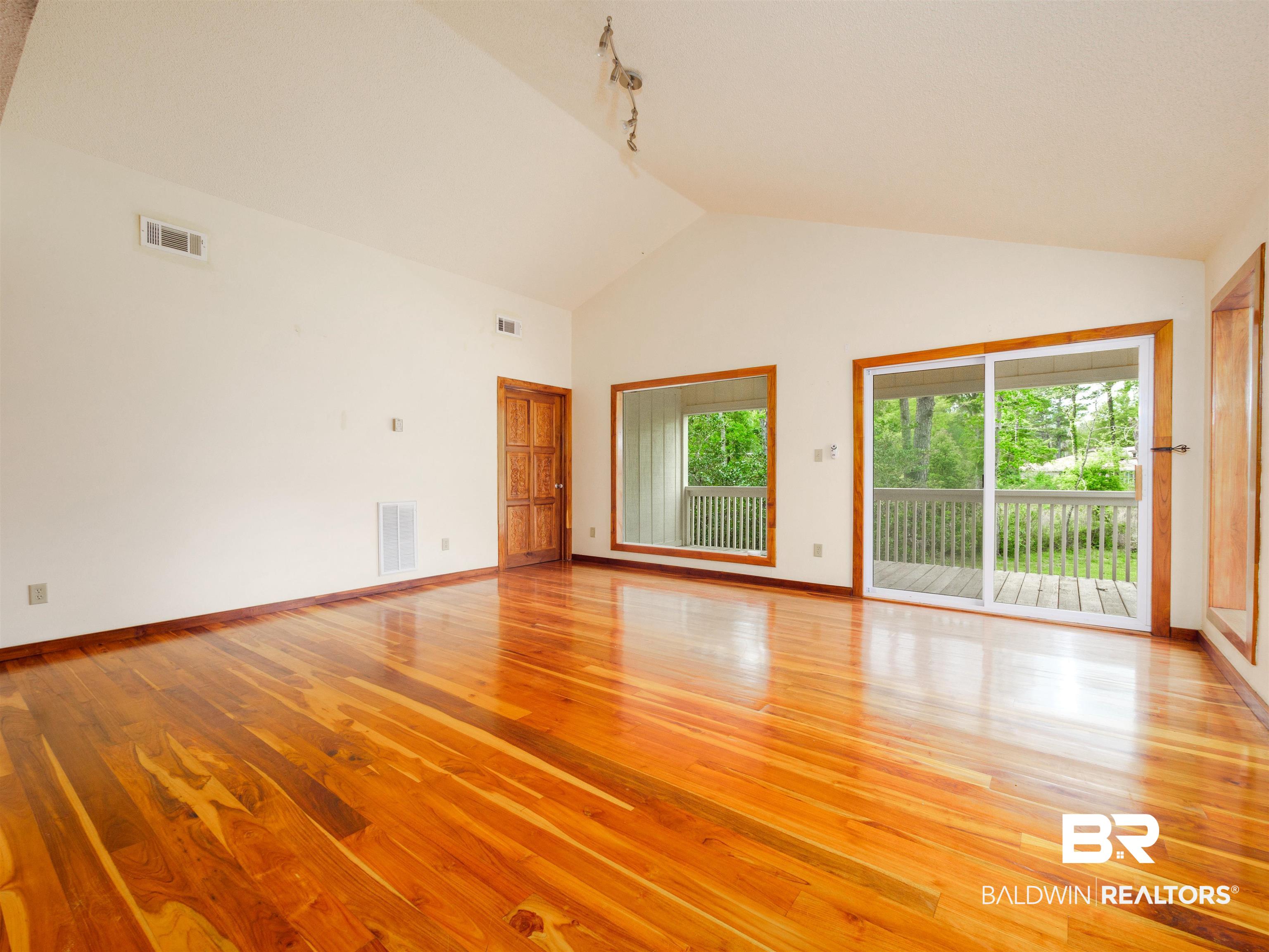 12831 Clay City Road Fairhope, AL 36532 - Photo 25 of 47 Private deck, bedroom, great room, walk in closet