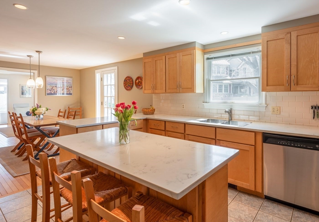 4 Graystone Road Gloucester, MA 01930 - Photo 15 of 34 a kitchen with a table chairs sink and cabinets