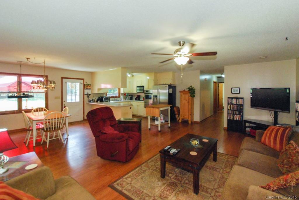 2256 Lawrence Road, Unit 7 Clover, SC 29710 - Photo 3 of 18 a living room with furniture a flat screen tv and kitchen view