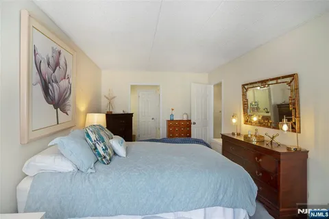a bed room with a bed and a television