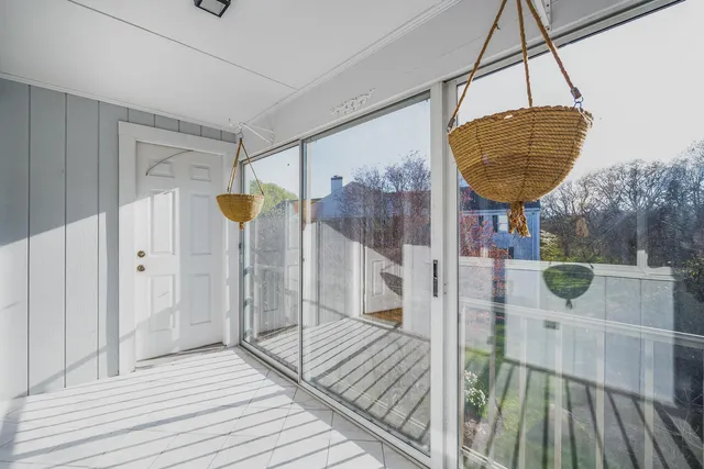 a view of a room with a window and chandelier