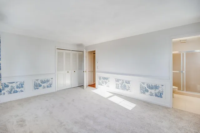 a view of a room with wooden floor and walls