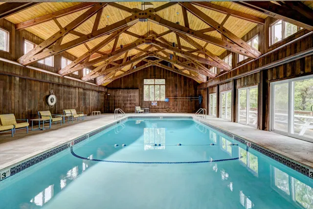 a view of a backyard with a swimming pool