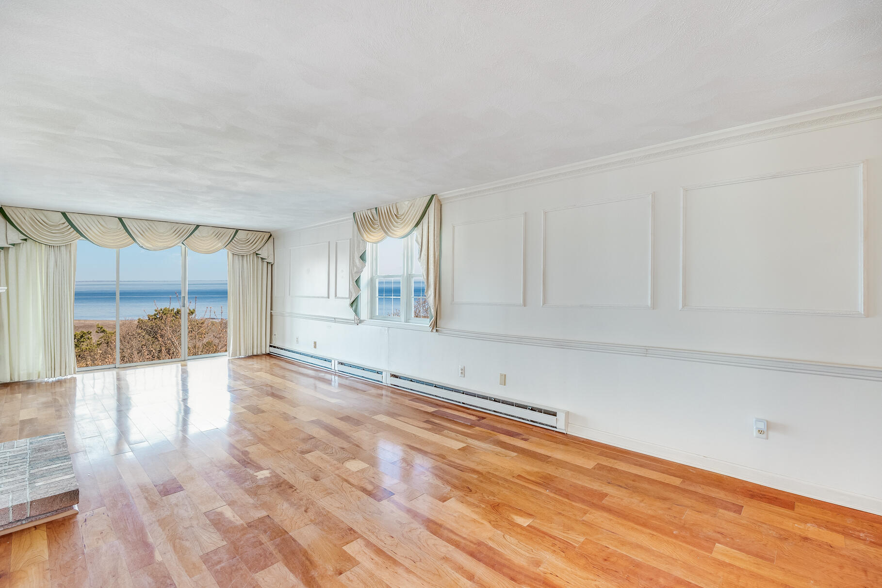 33 Highview Drive Sandwich, MA 02563 - Photo 7 of 38 a view of an empty room with wooden floor and a window