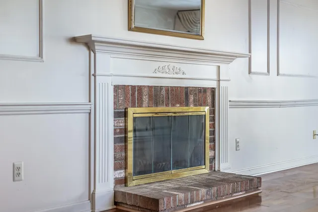 a bedroom with a fireplace