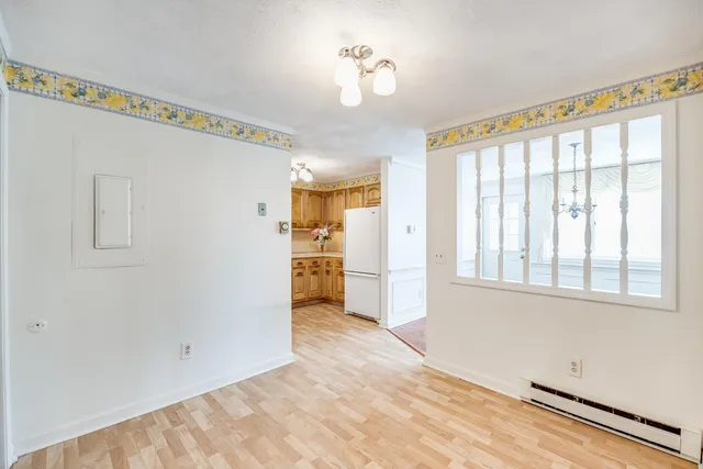 a view of a room with a windows and kitchen view