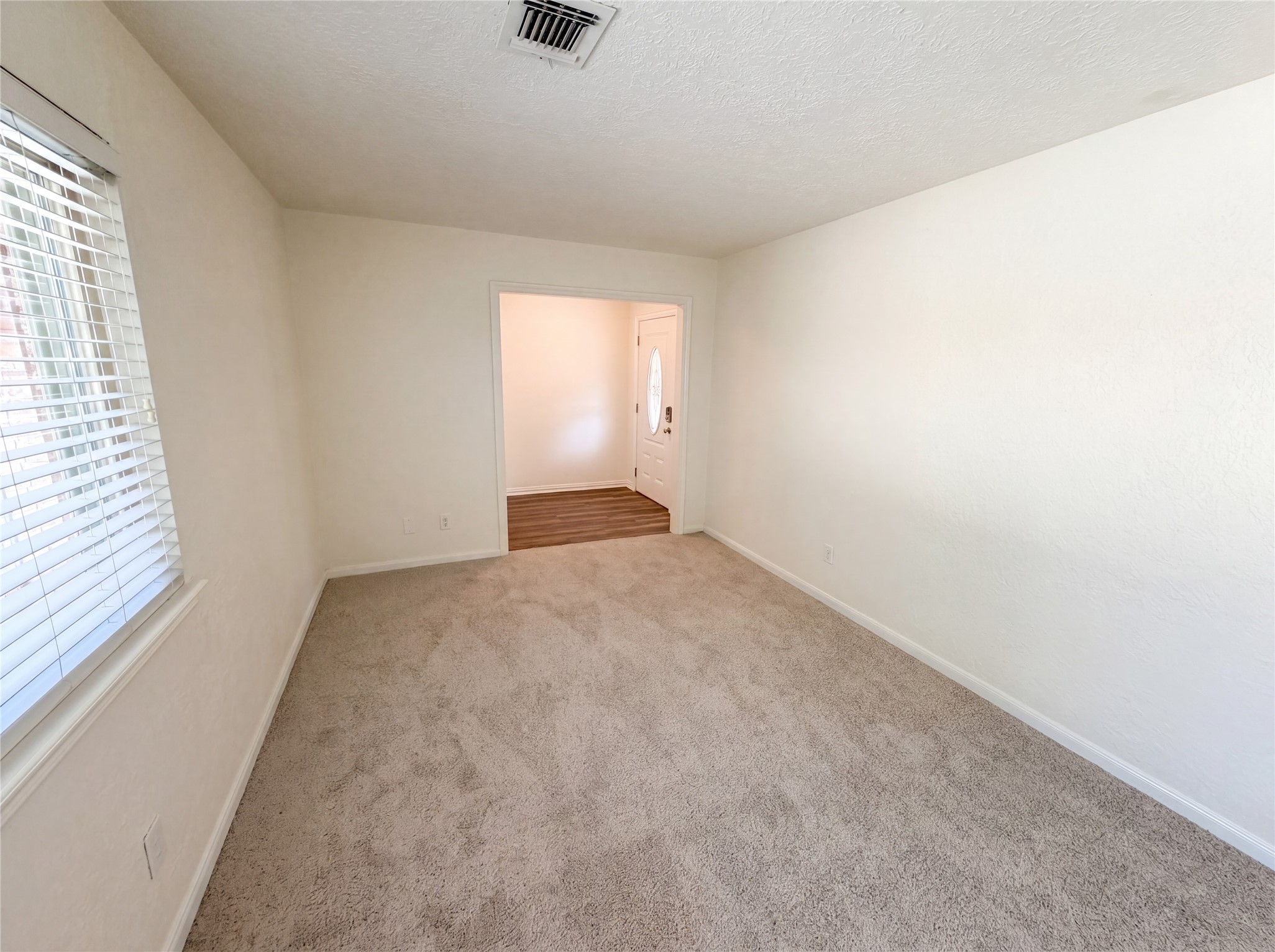 342 Queenstown Road Houston, TX 77015 - Photo 10 of 22 an empty room with a empty space and a window