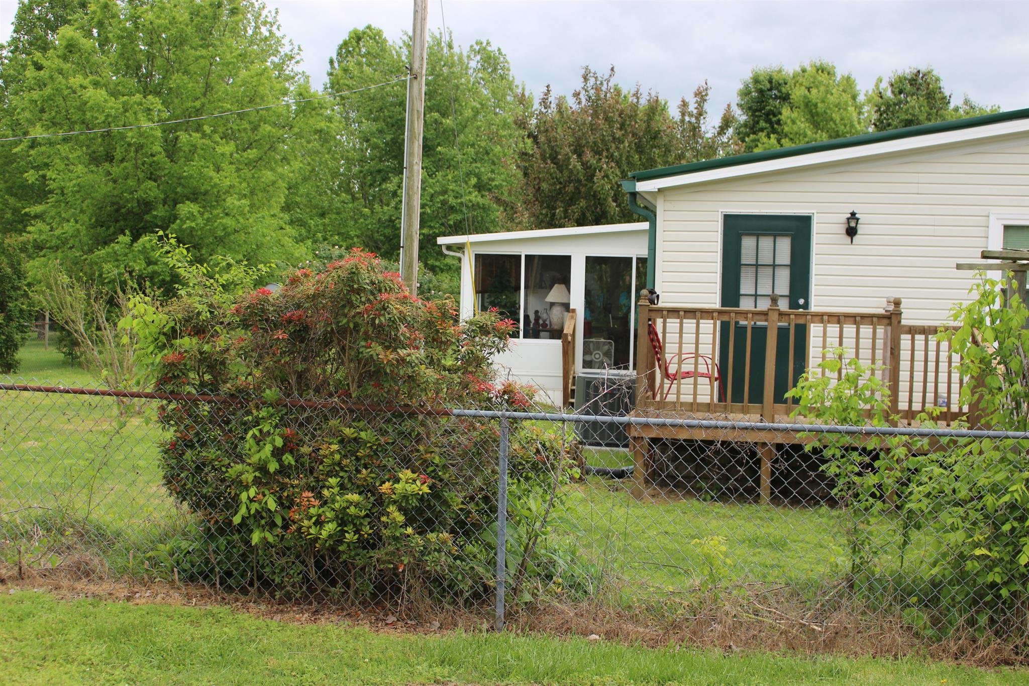 2049 Sugar Camp Road Springfield, TN 37172 - Photo 5 of 6 a house with trees in the background