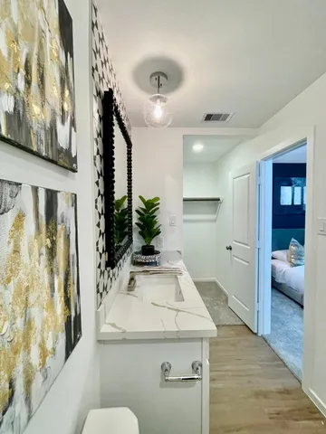a bathroom with a sink and mirror
