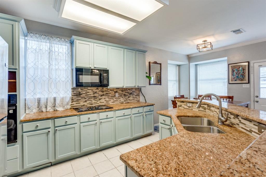 2031 Knights Court Allen, TX 75013 - Photo 4 of 12 a large white kitchen with a stove and a refrigerator