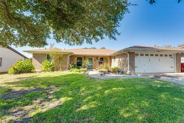 a front view of a house with swimming pool having outdoor seating
