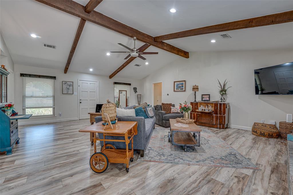 903 Walnut Street Royse City, TX 75189 - Photo 4 of 28 a living room with furniture and a flat screen tv