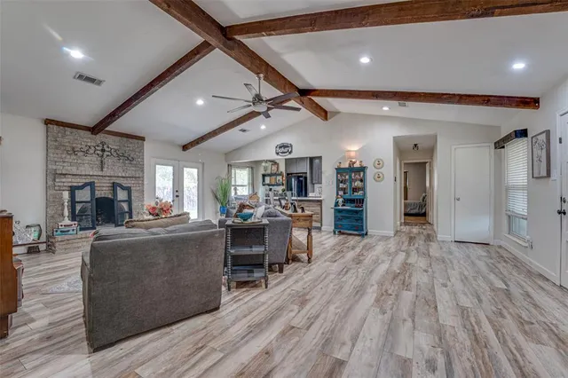 a living room with furniture and a fireplace
