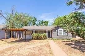 2314 35th Street Lubbock, TX 79412 - Photo 1 of 9 a front view of a house with a yard