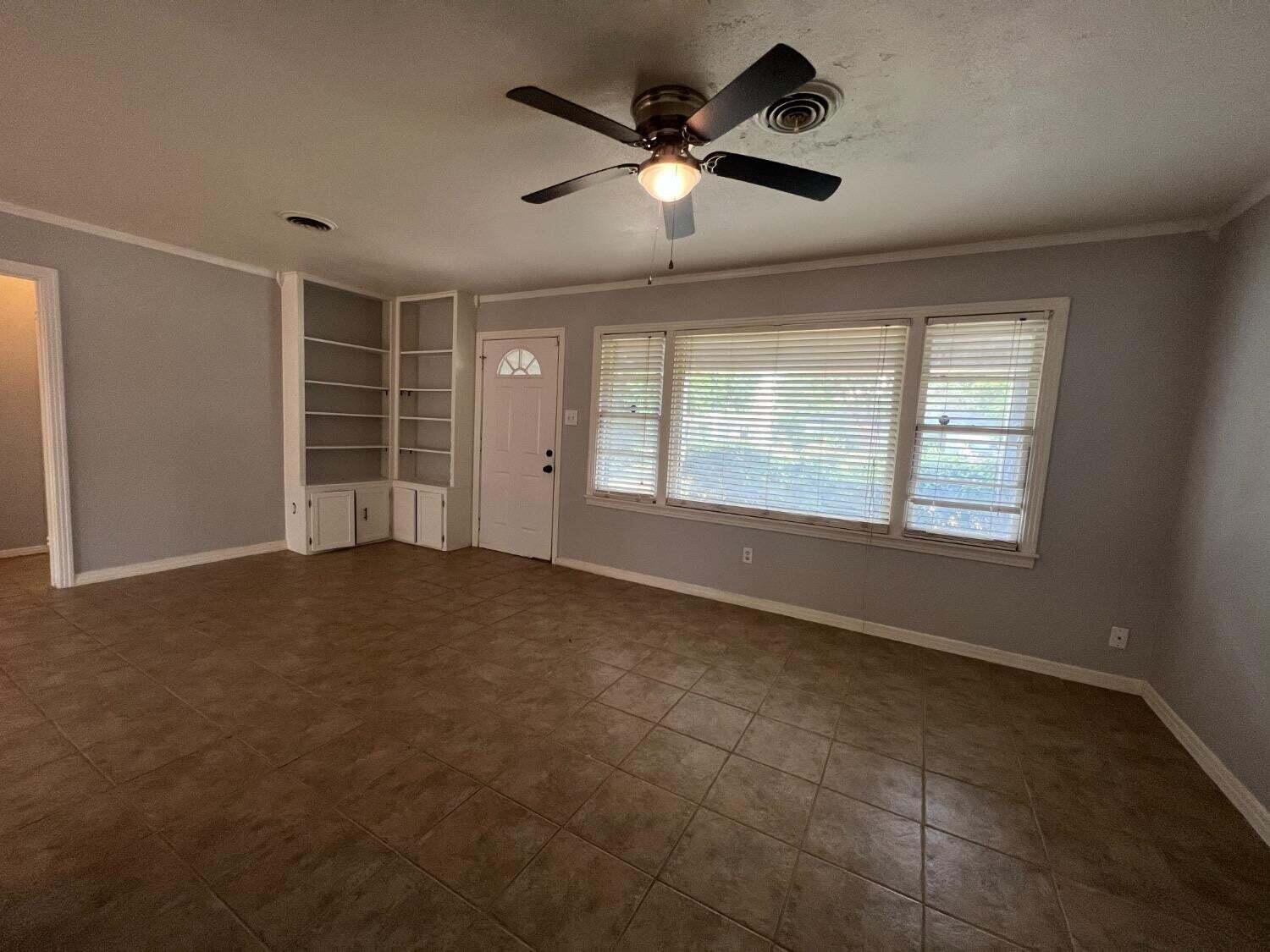 2314 35th Street Lubbock, TX 79412 - Photo 2 of 9 a view of an empty room with a window