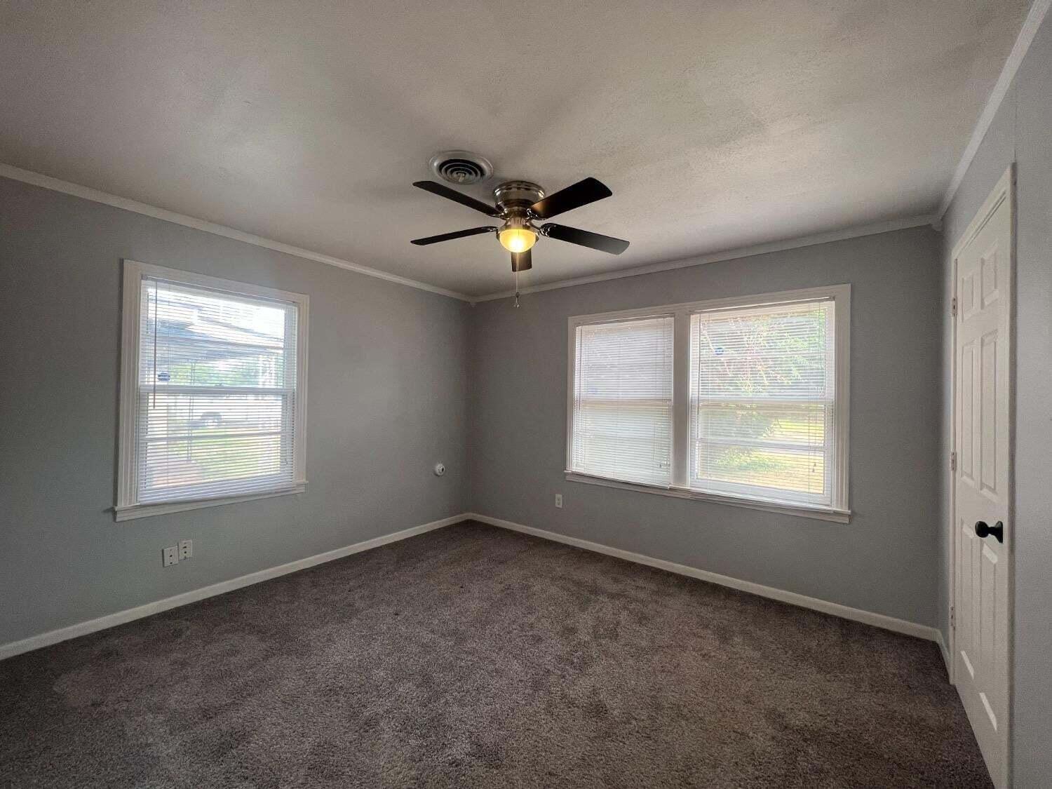 2314 35th Street Lubbock, TX 79412 - Photo 8 of 9 a view of an empty room with a window