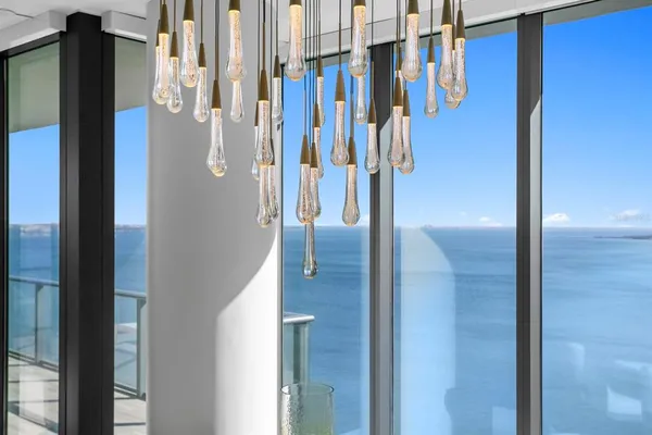 a kitchen with white cabinets and a sink