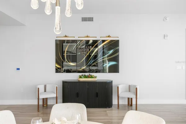a living room with furniture and a kitchen view