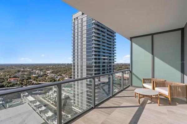 a view of a bathroom with a glass door shower