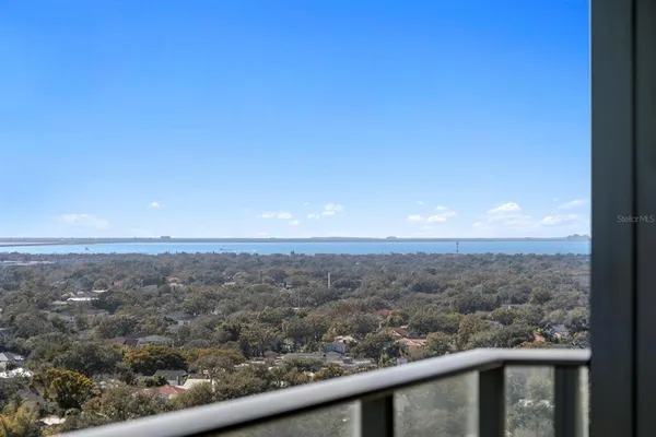 a bathroom with a double vanity sink mirror and shower
