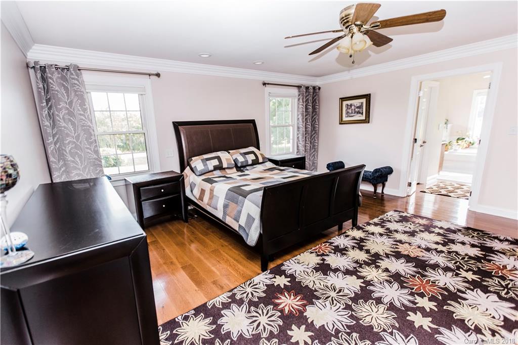 9225 Belt Road Midland, NC 28107 - Photo 5 of 14 a bedroom with a bed and wooden floor