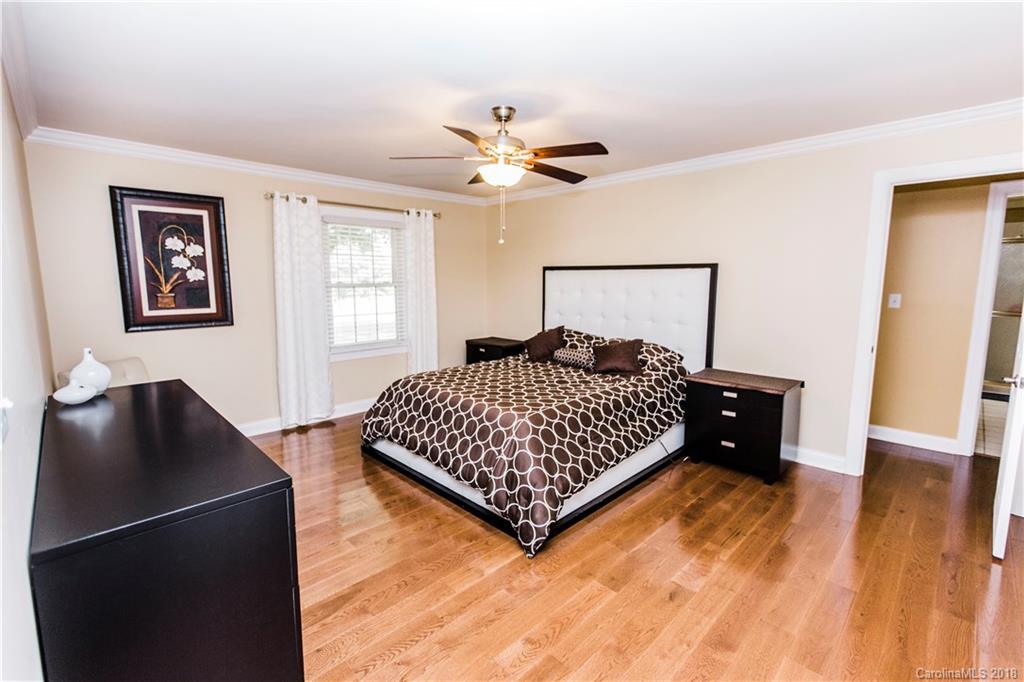 9225 Belt Road Midland, NC 28107 - Photo 6 of 14 a bedroom with a bed and wooden floor